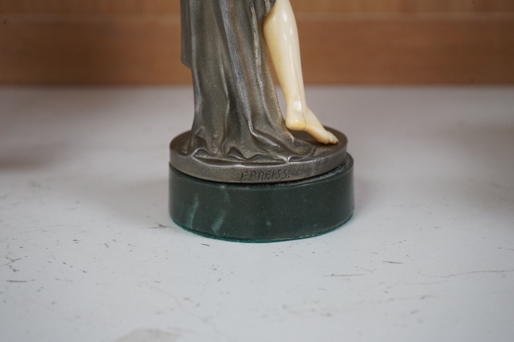 After F. Preiss, an Art Deco style silvered metal and ivorine figure, 'Vanity', 22cm high